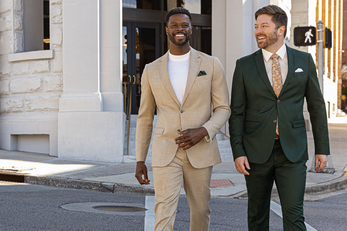 Two men in tan and green suits walking in downtown Chattanooga